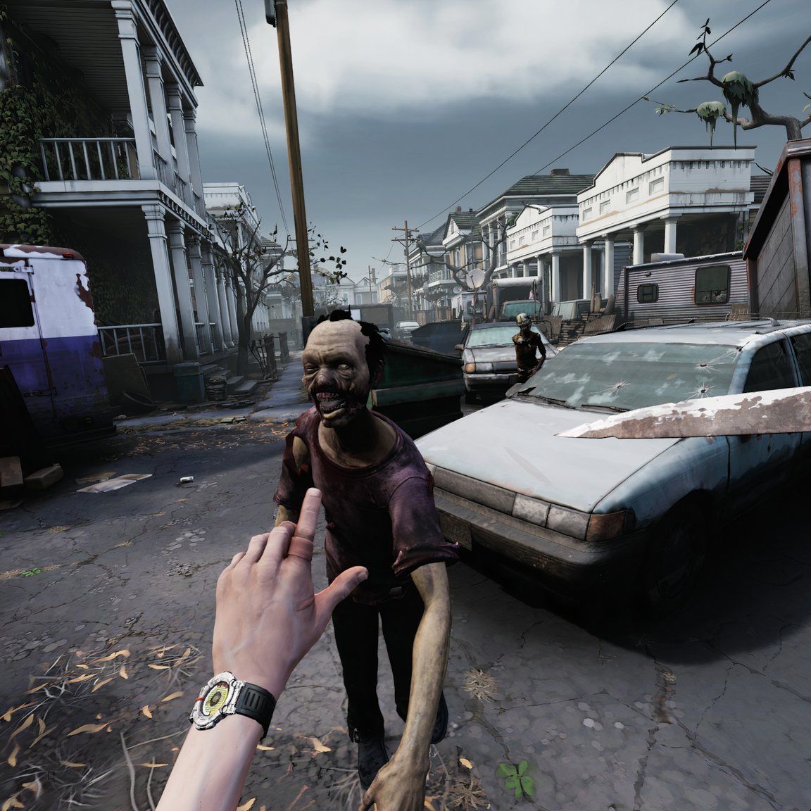 A first-person perspective of someone wielding a knife against a rapidly approaching zombie.