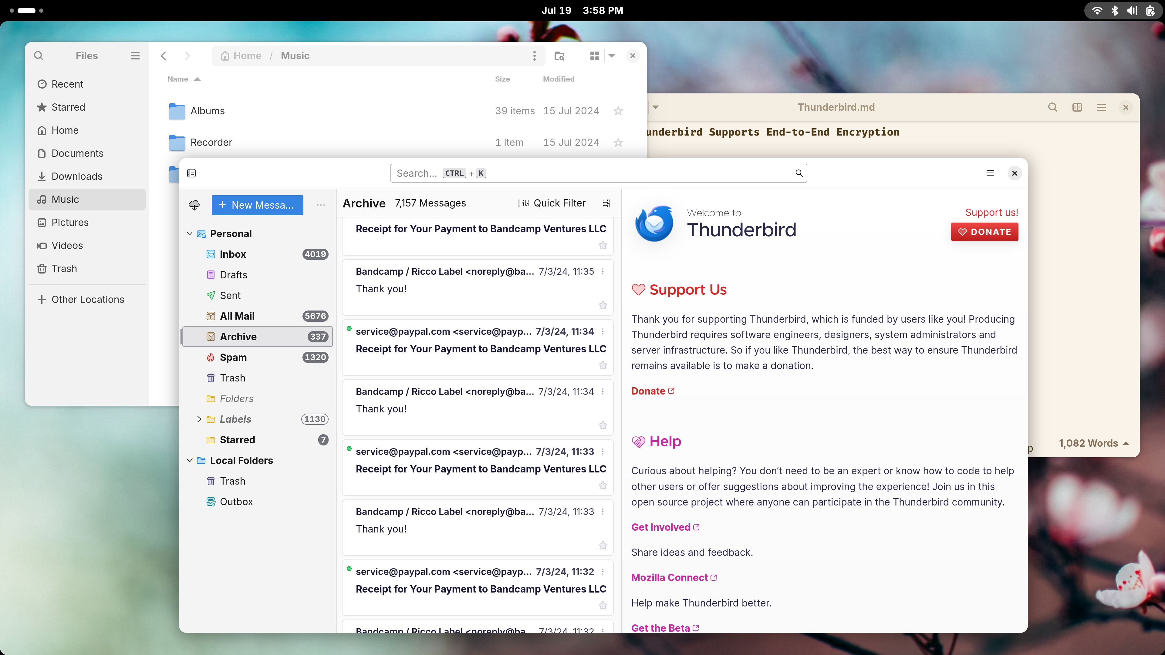 GNOME desktop with Thunderbird email client open alongside other apps.