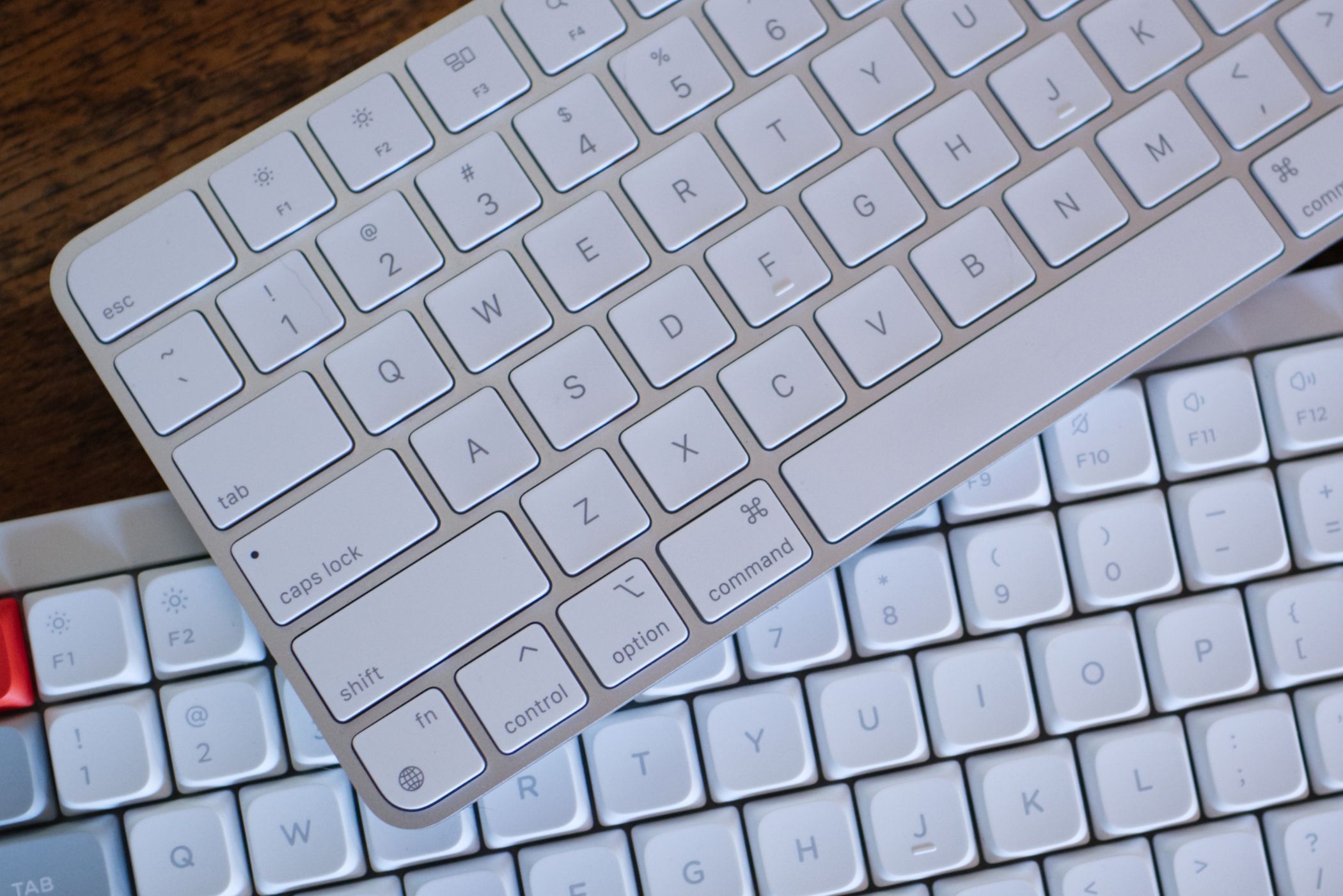 Apple Magic Keyboard and the NuPhy Air75 mechanical keyboard.