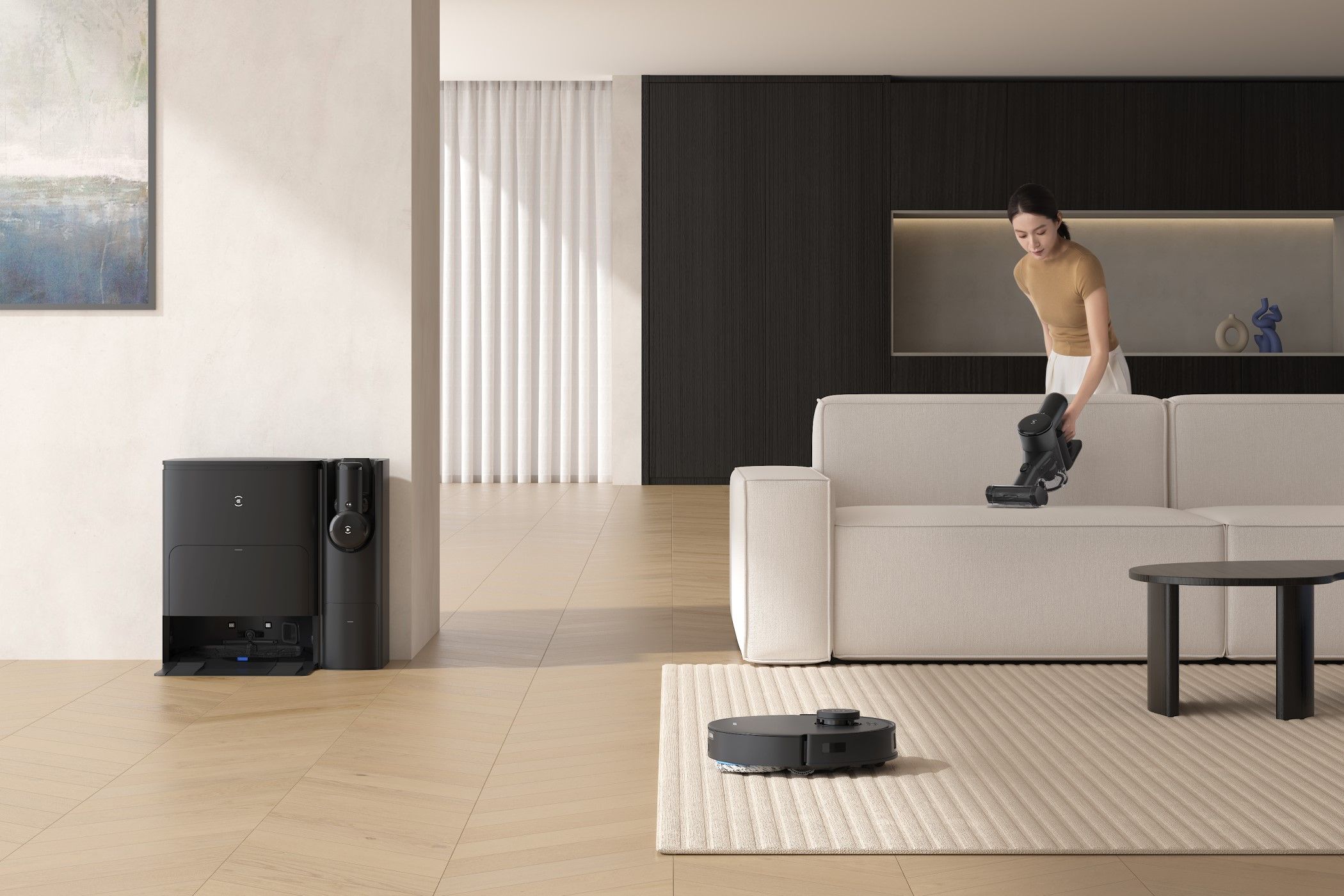 Deebot T30S Cleaning a Carpet and a Woman Using the Handheld Vacuum
