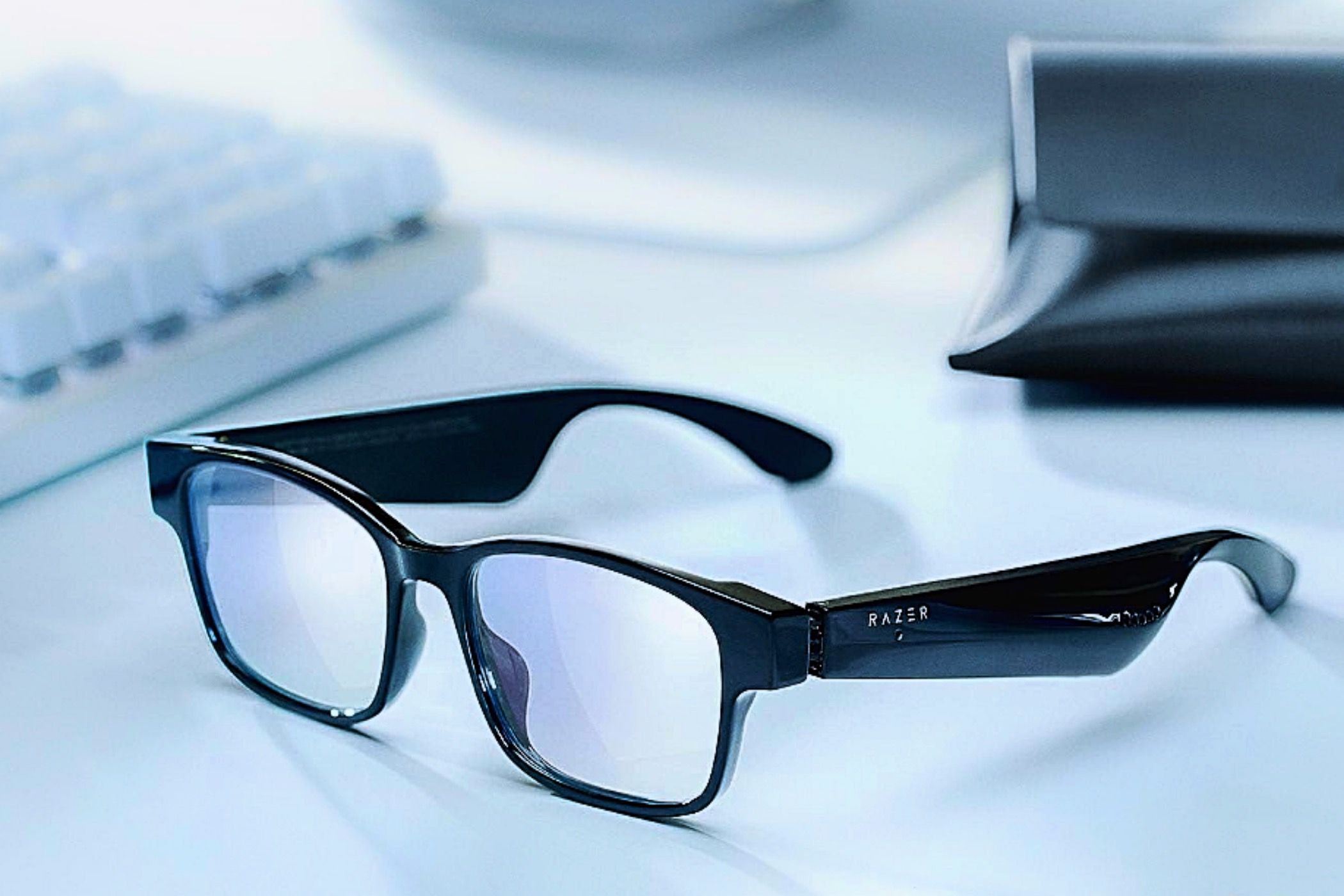 A pair of Razer Anzu Smart Glasses sitting on the desk