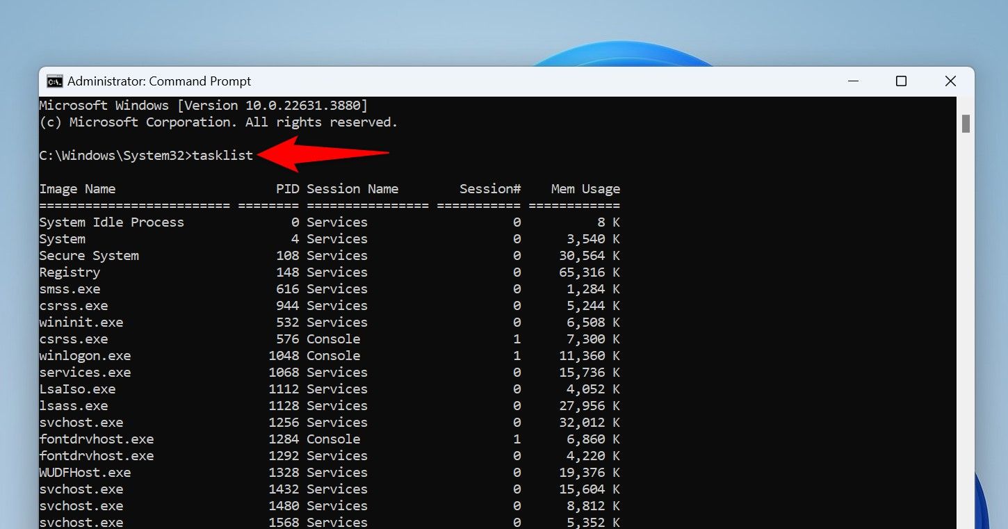 The 'tasklist' command typed in Command Prompt.