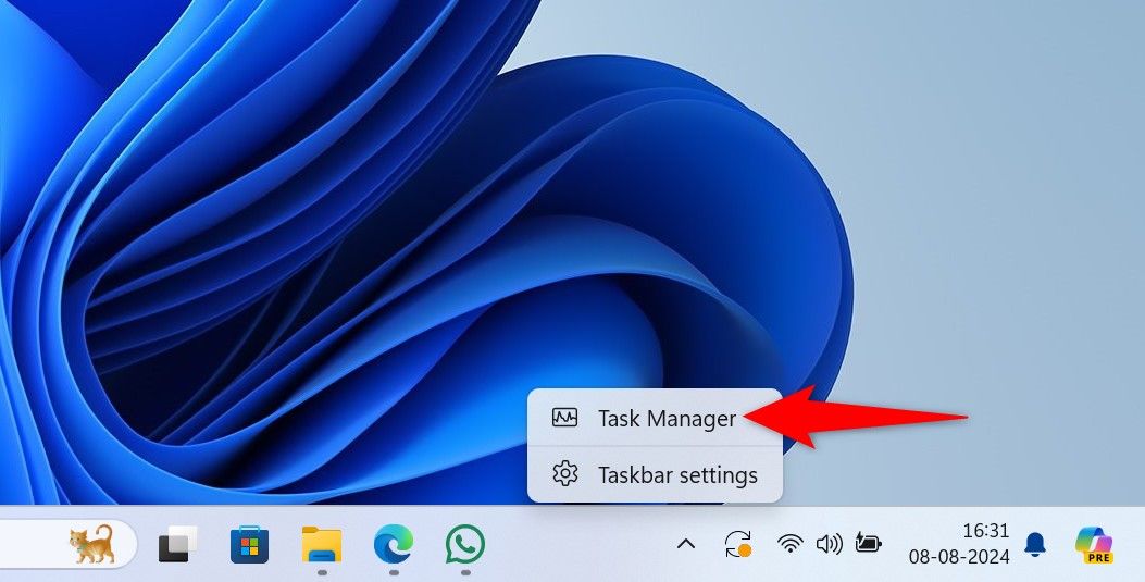 'Task Manager' highlighted in the Windows taskbar context menu.