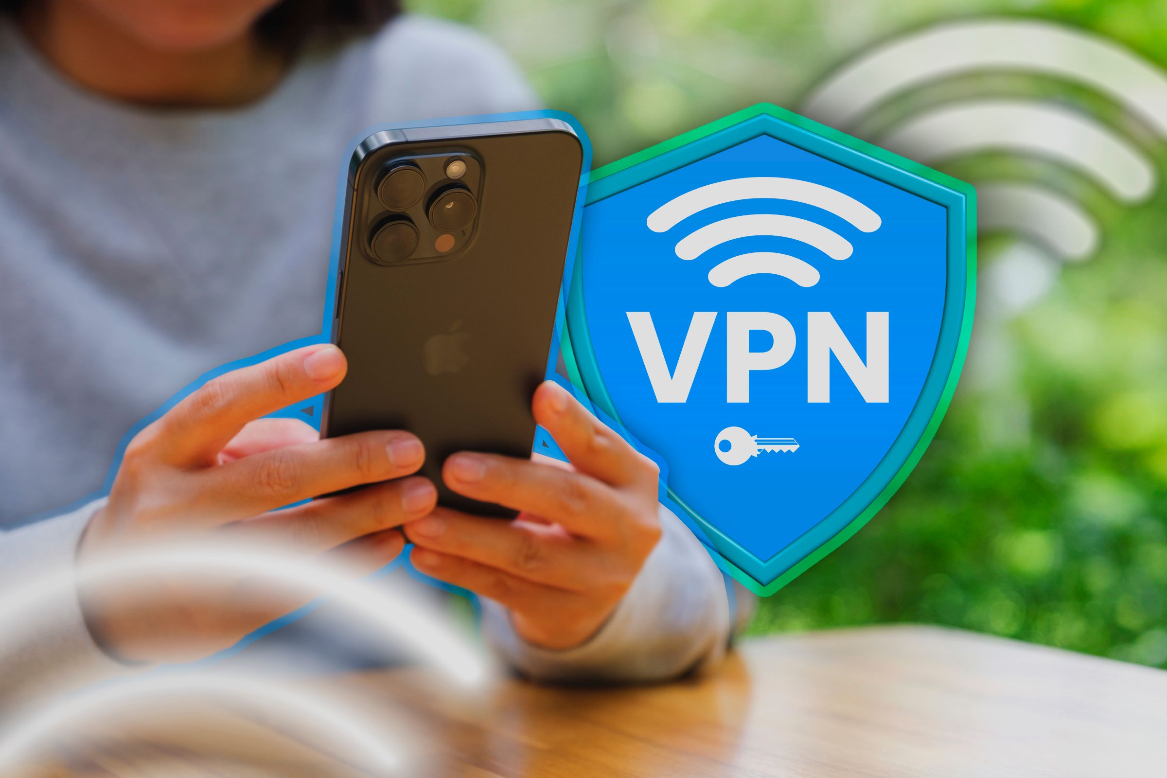 A person using an iPhone with a VPN shield icon next to it.