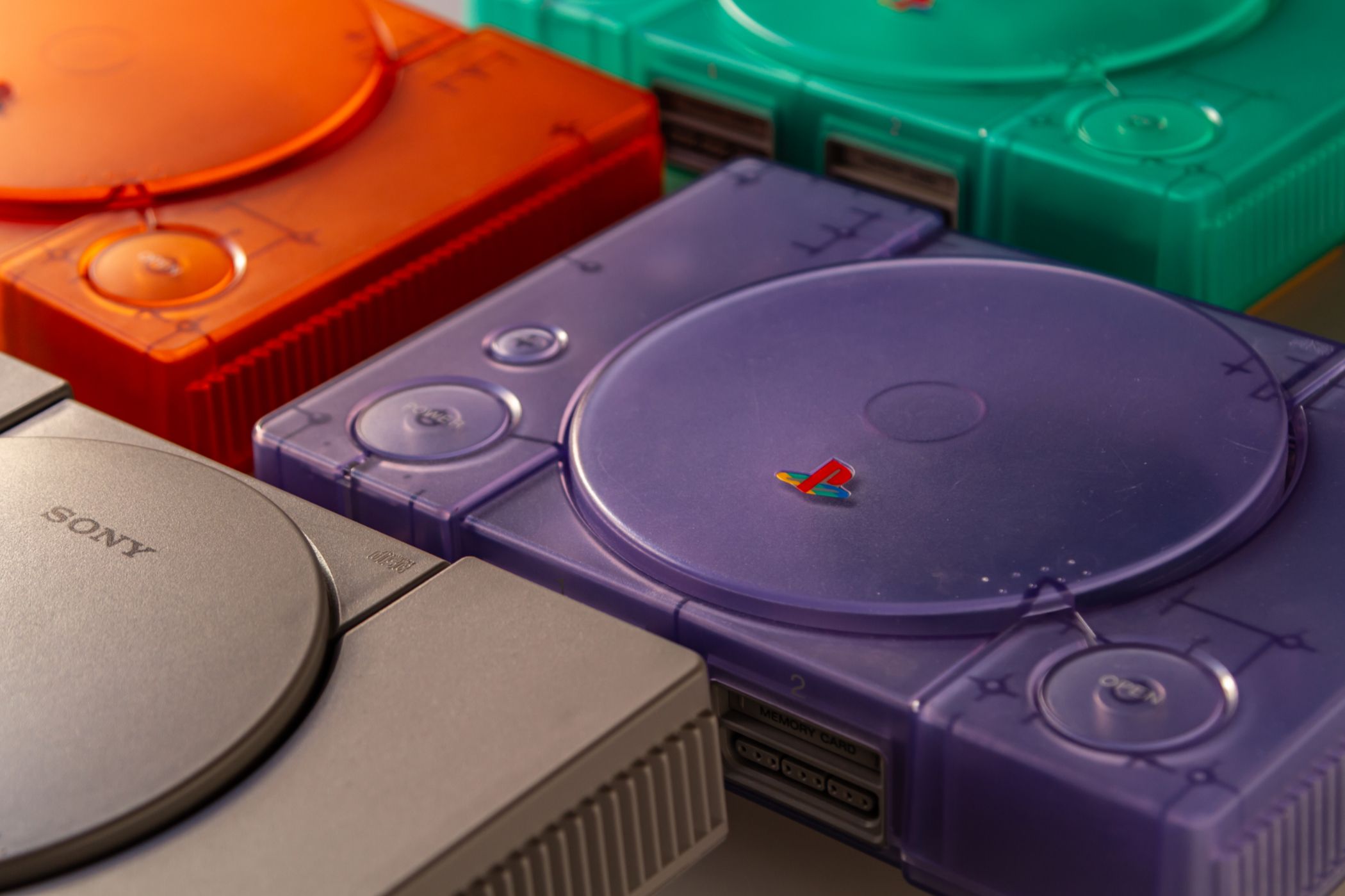 A variety of original PlayStation consoles.