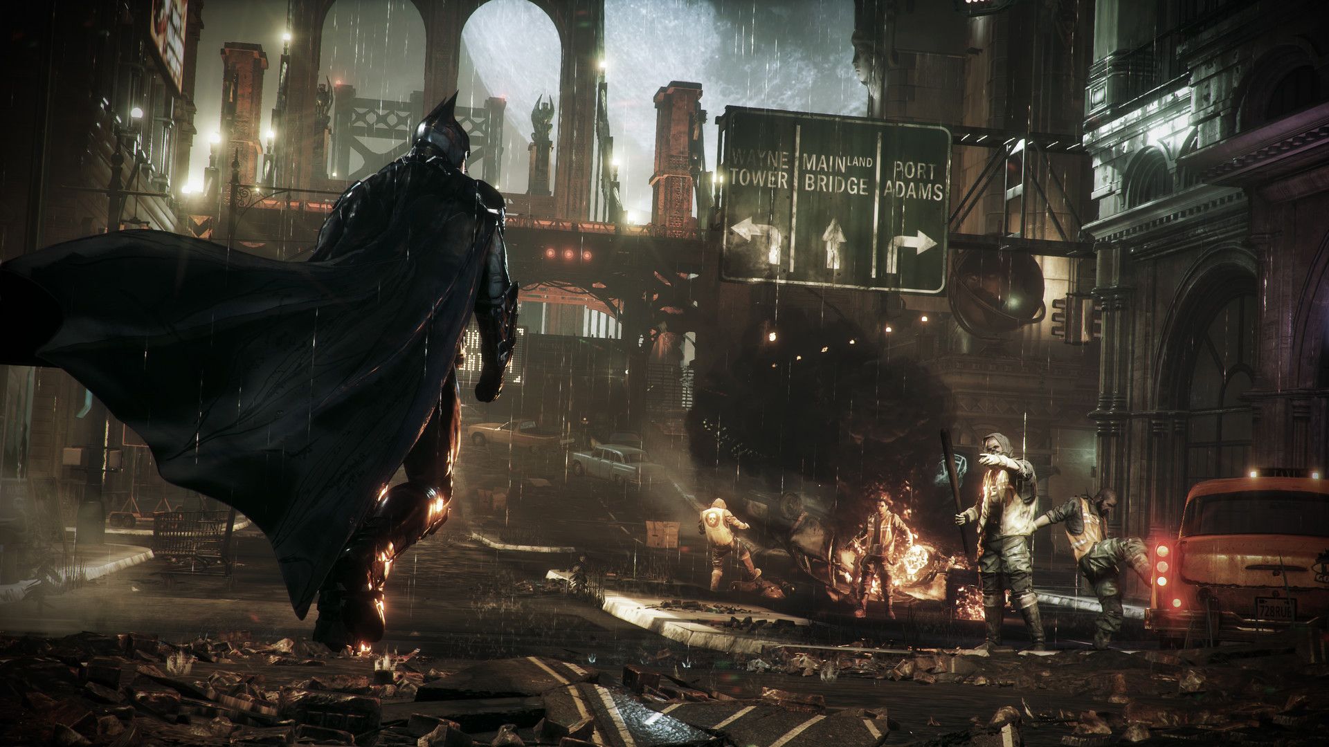 Batman Arkham Knight official image showing Batman approaching bad guys in the rain.