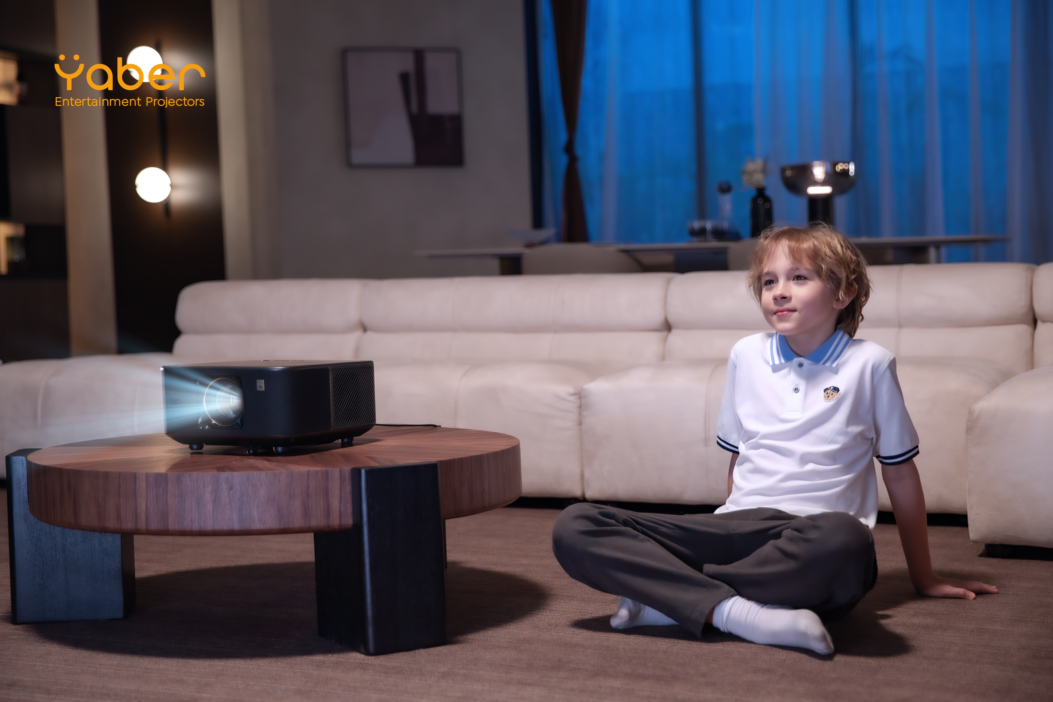 A Young Boy Watching a Movie With the Yaber K3 Projector