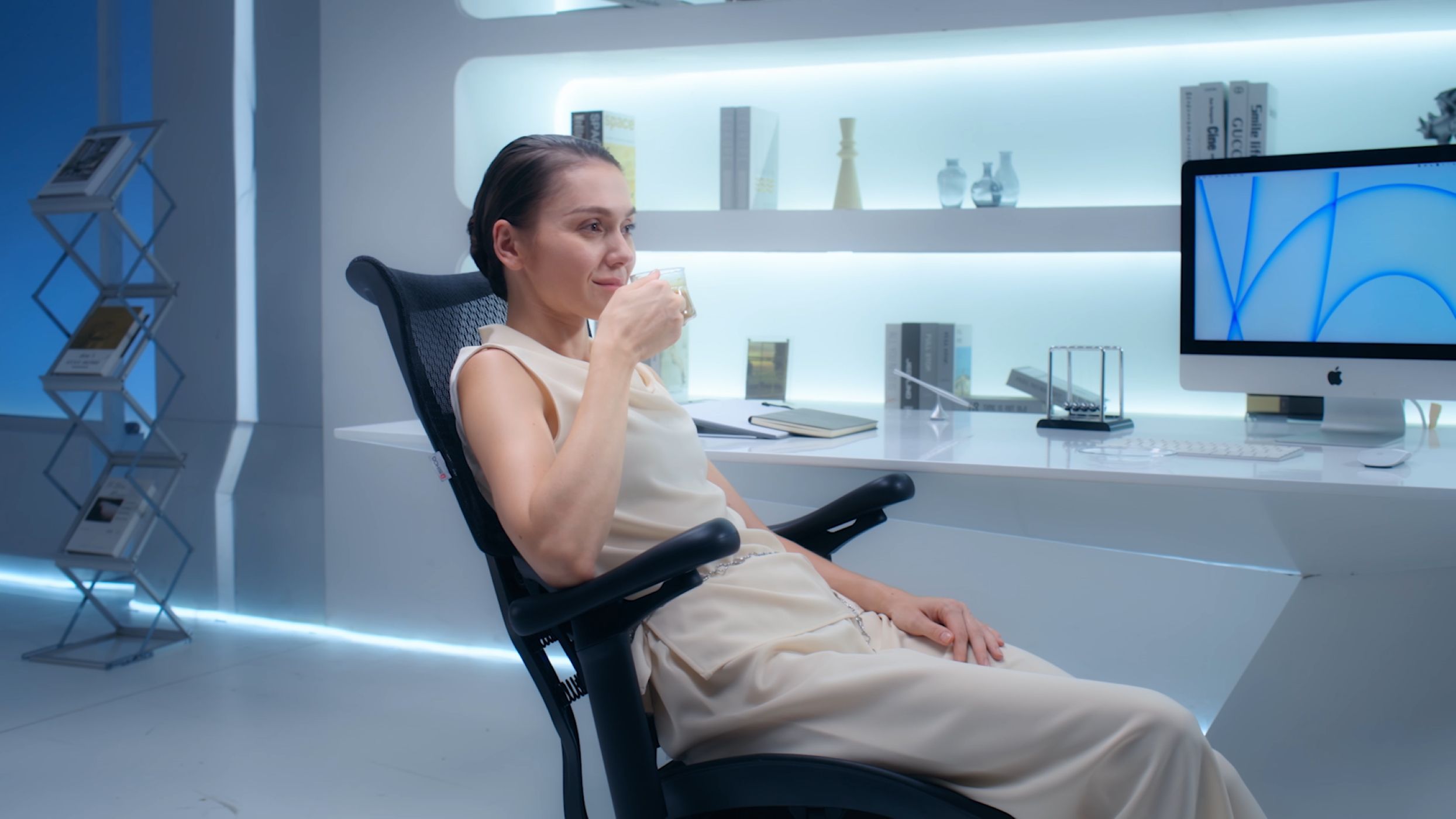 A Female Executive Having Tea on the Doro S100 Chair