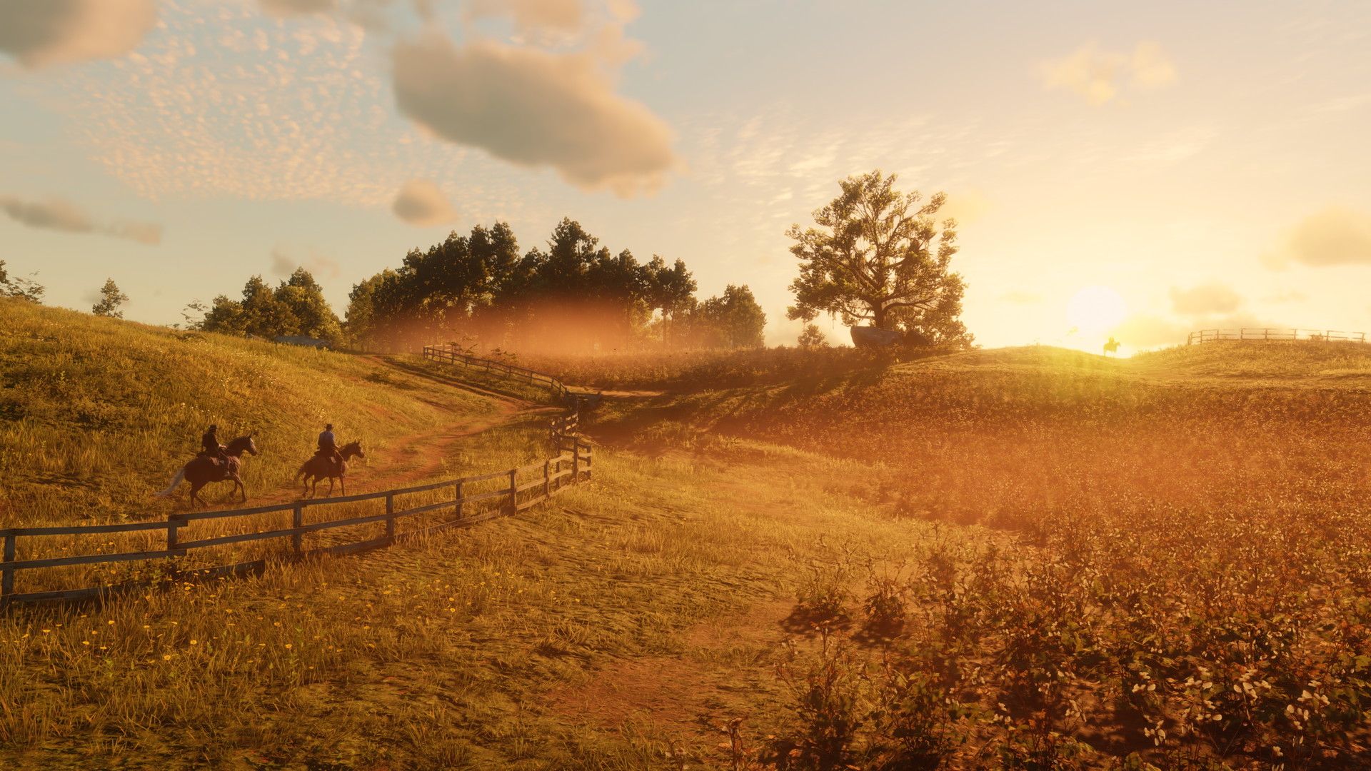 Red Dead Redemption 2 official screenshot showing two coqboys riding through a field 