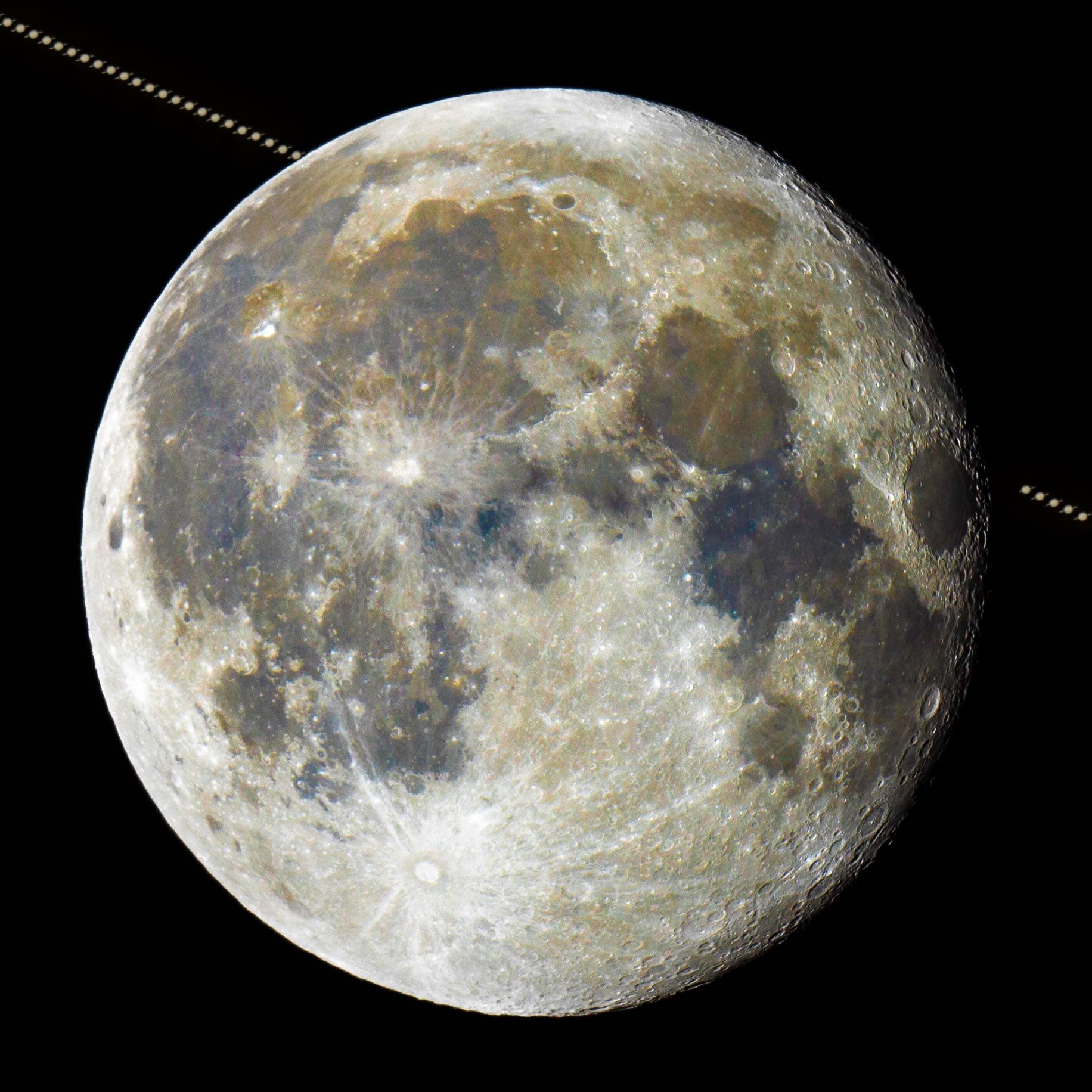 Saturn passing behind the moon.