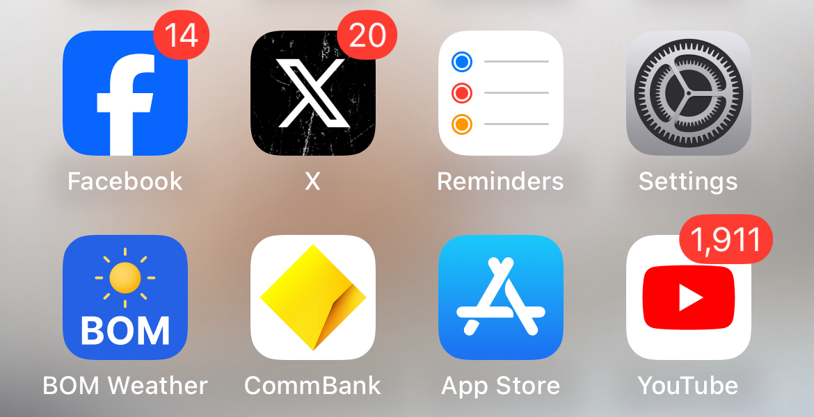 Unsightly notification badges in iPhone apps on a Home Screen.