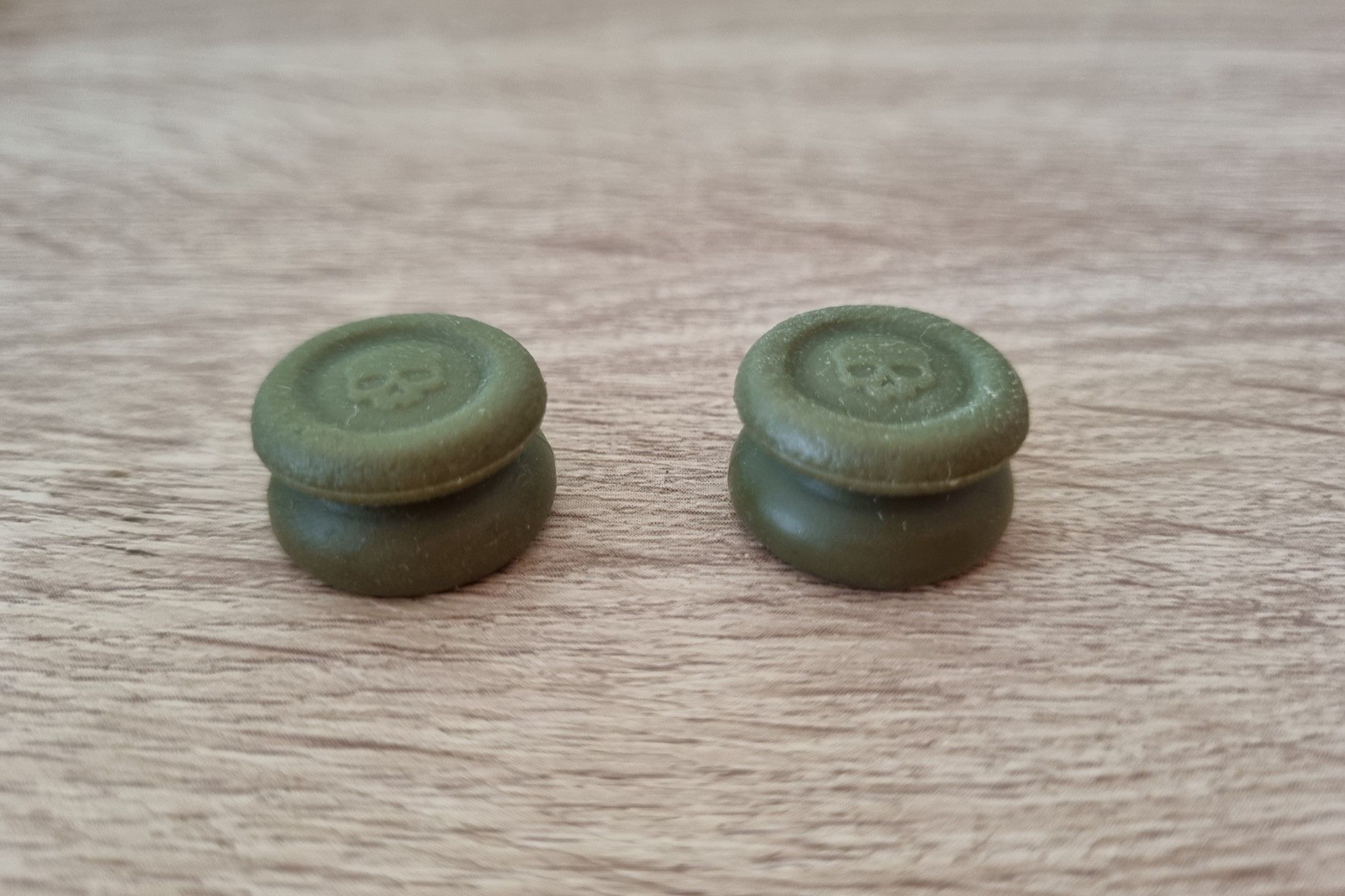 A pair of tall thumbstick covers. 