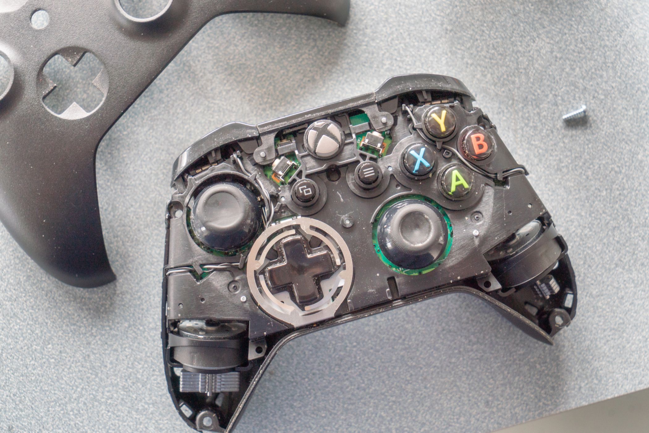 Xbox One controller with the faceplate removed.