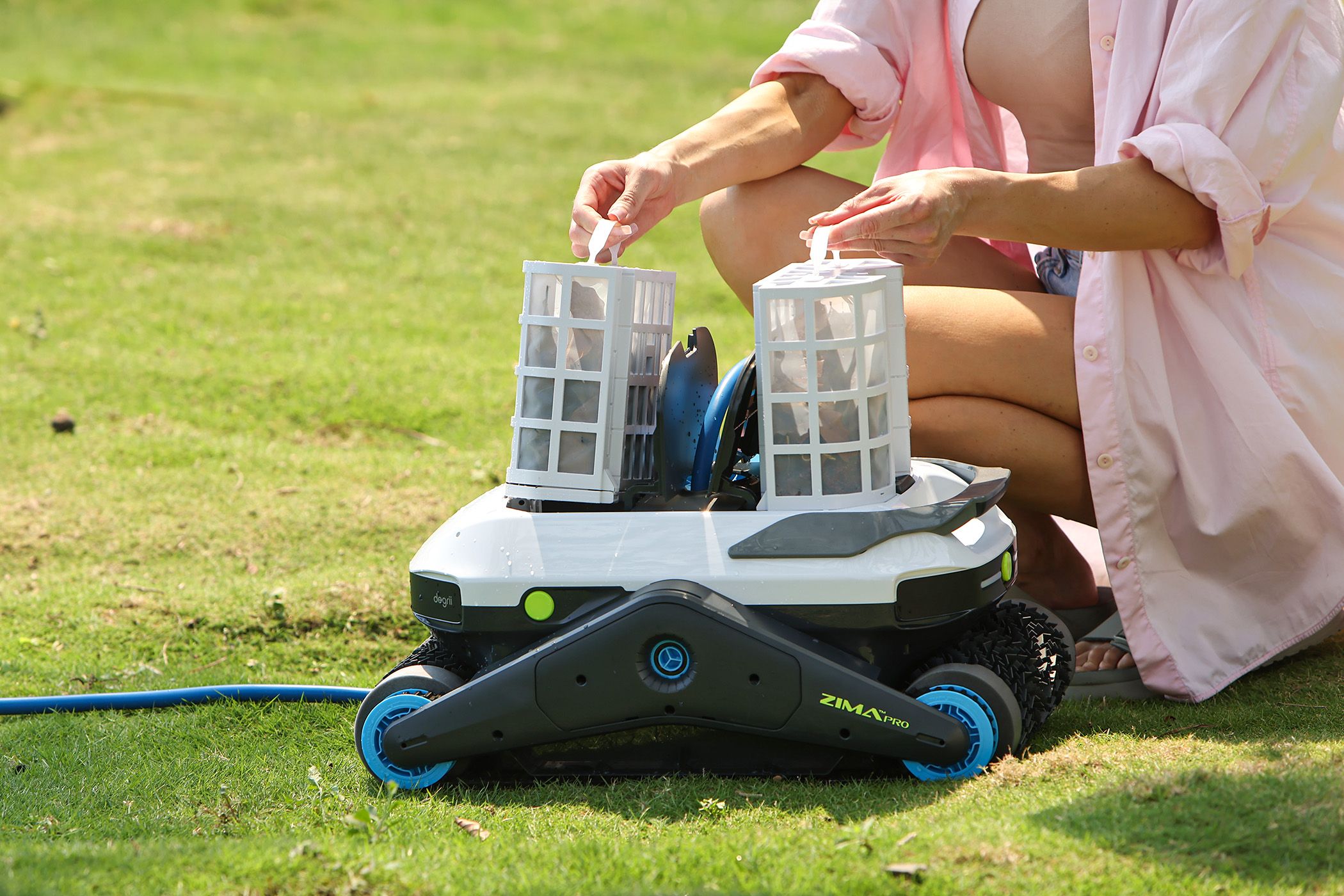  A Woman Taking Out the Dual Filter Basket of the Zima Pro