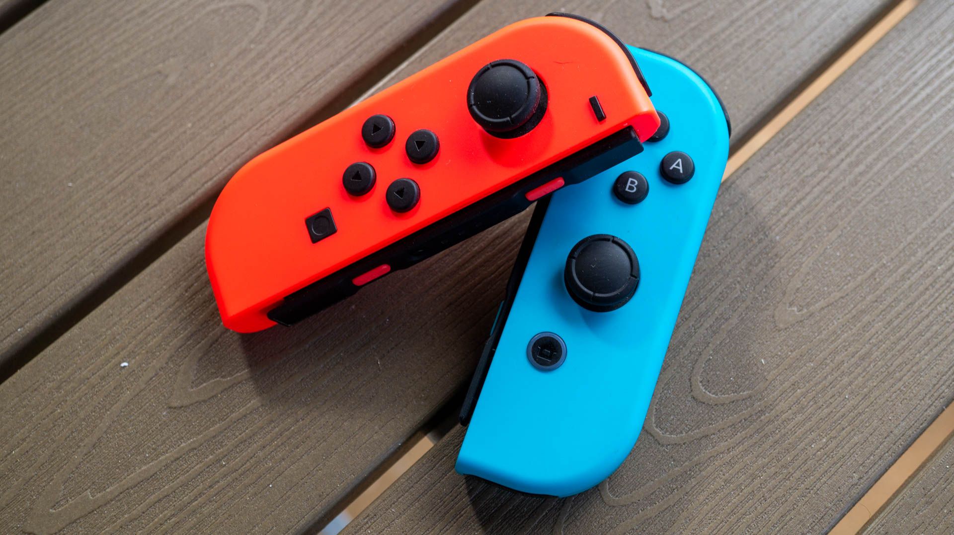 Nintendo Switch Joy-Cons sitting on a table.