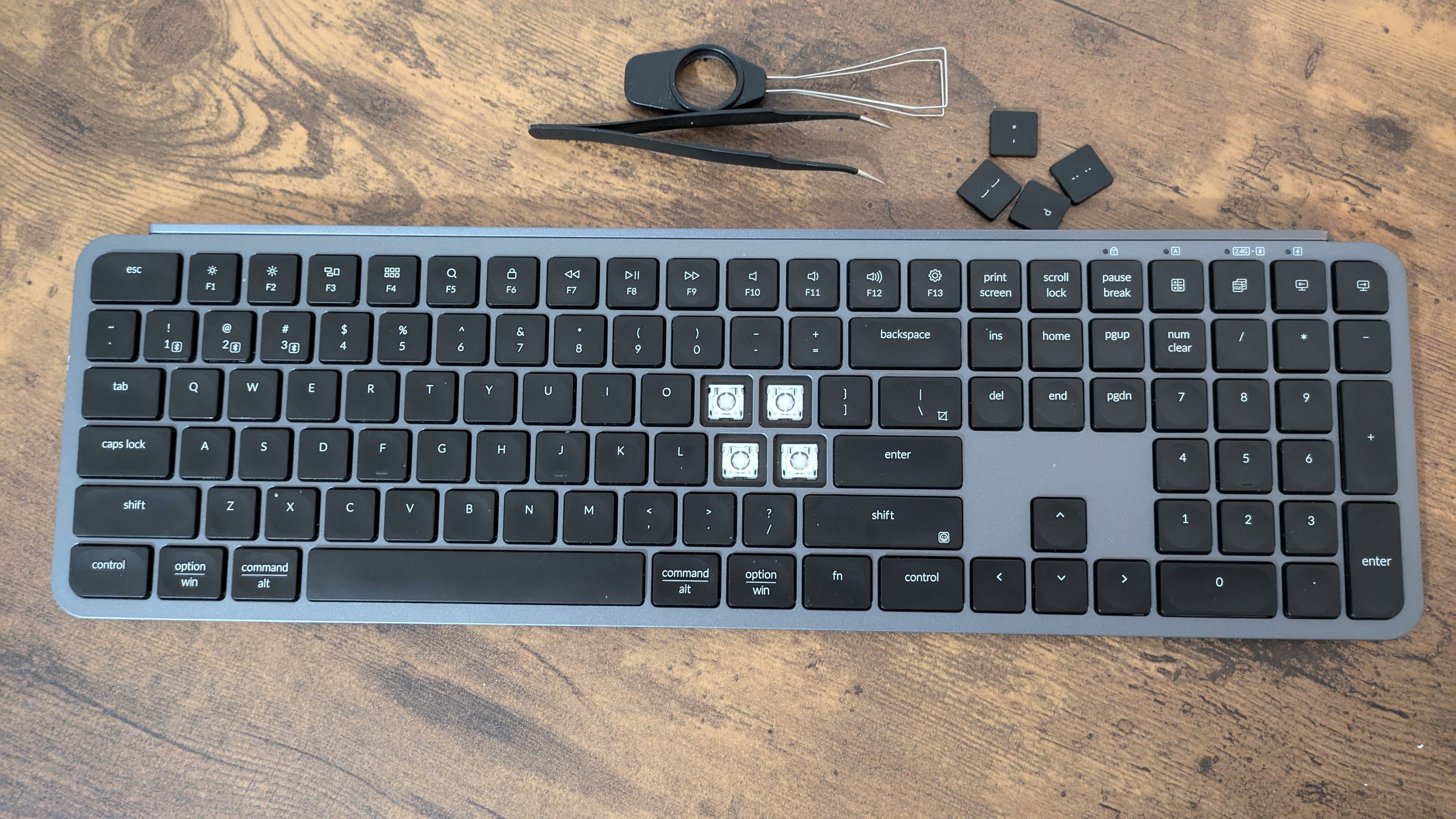 A scissor switch keyboard with some caps removed.