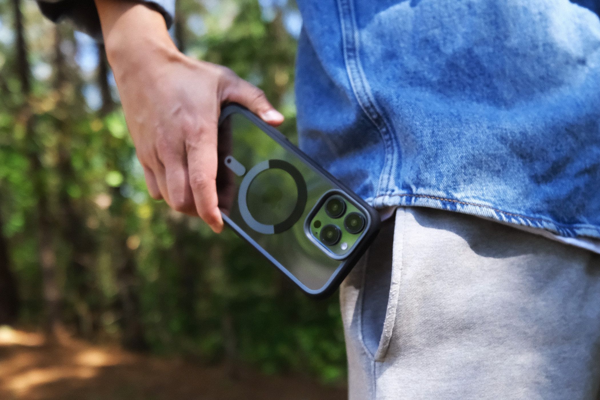 Person holding iPhone 16 in Supcase UB Mag case