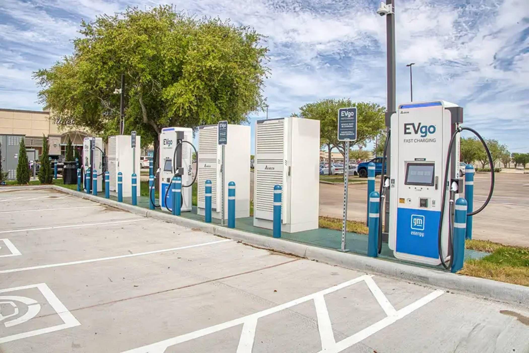 An EV Go Station on the side of a parking lot