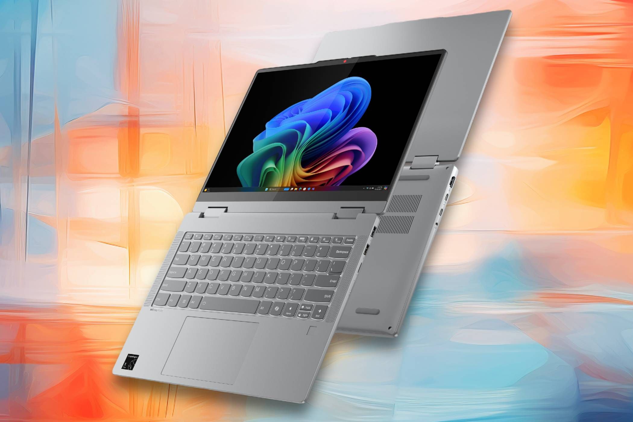 A sleek silver laptop with a flexible hinge, displayed against a colorful abstract background.