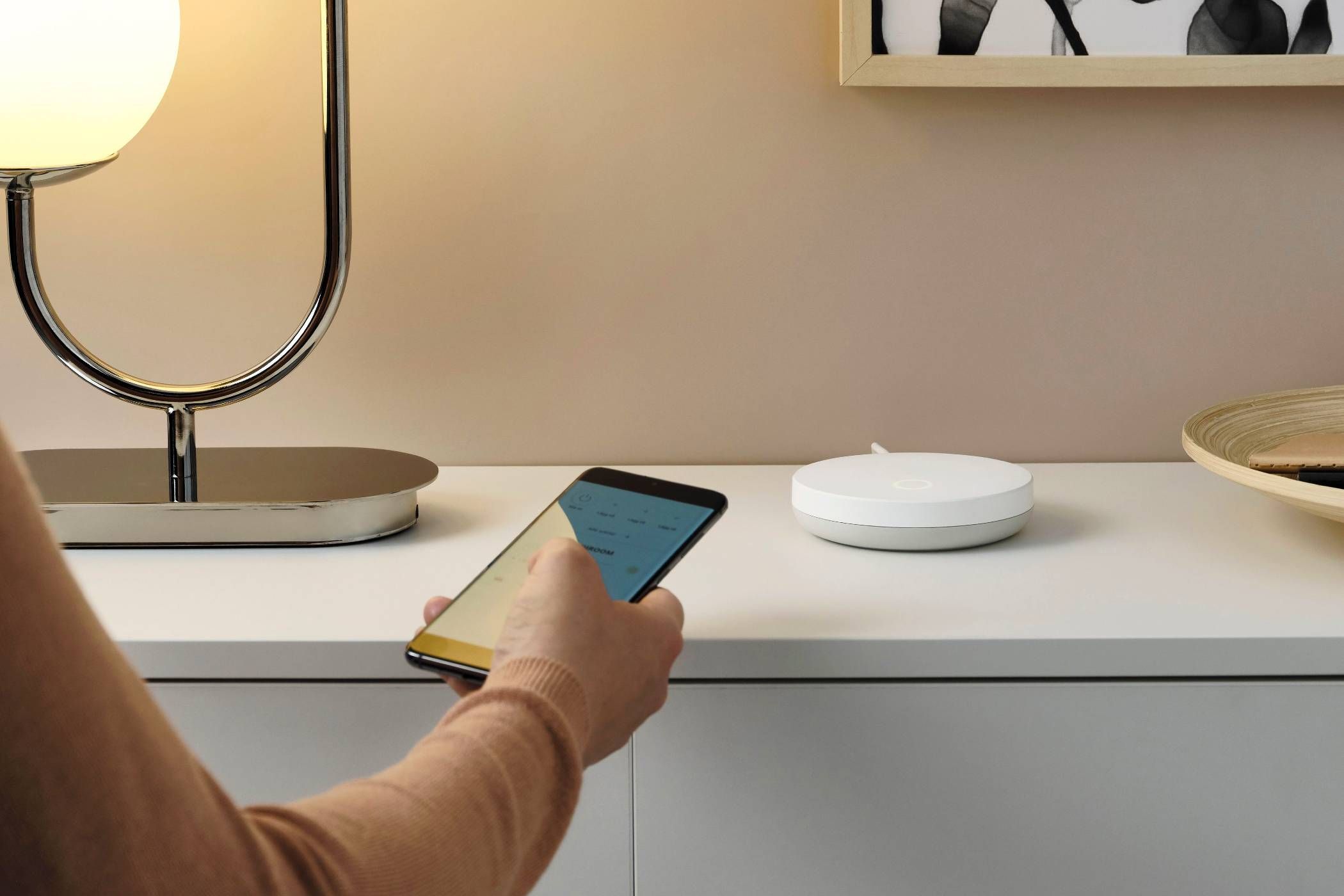 A phone using the Ikea Home app on a Dirigera Hub