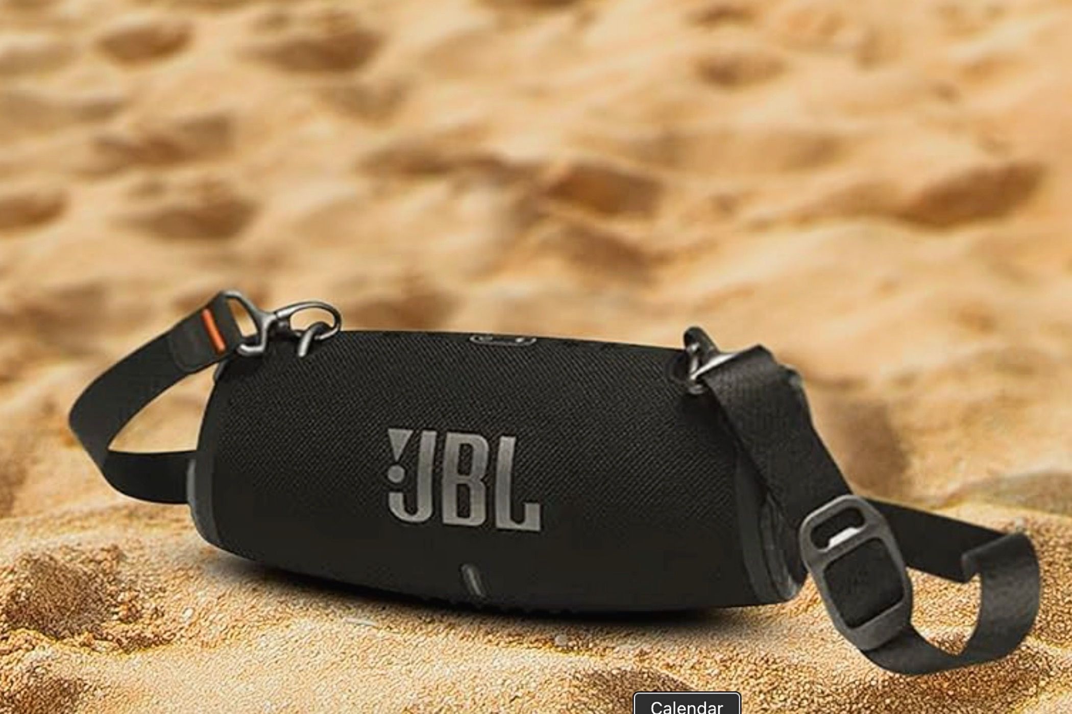 A JBL Xtreme 3 in the sand.