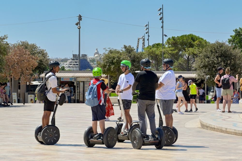 People riding Segways.