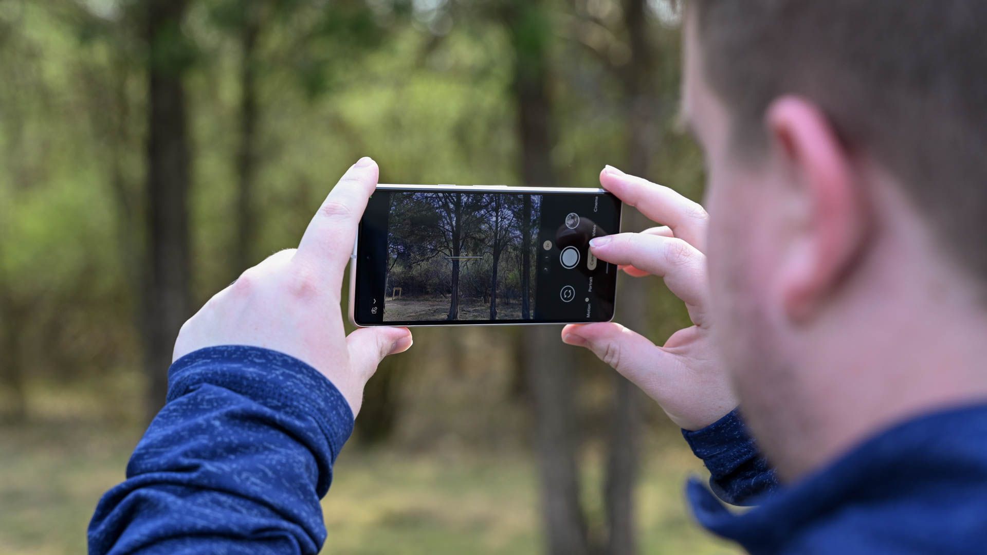 Preparing to shoot a video in woodland.