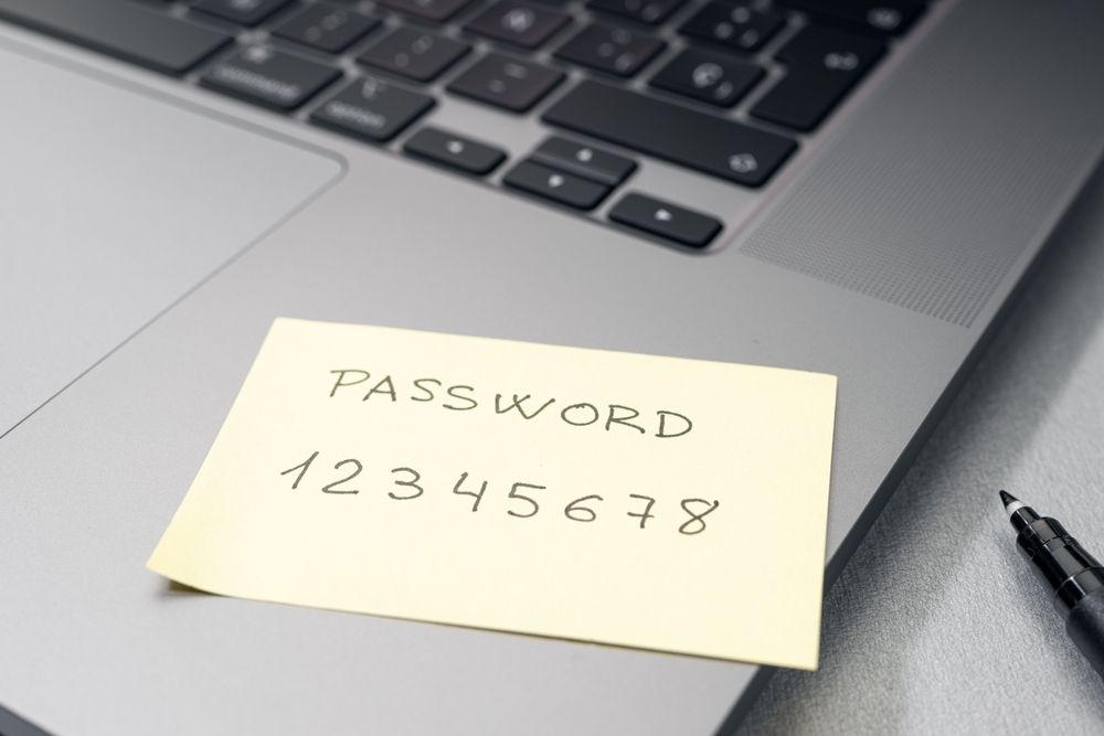 A generic password written on a sticky note. 