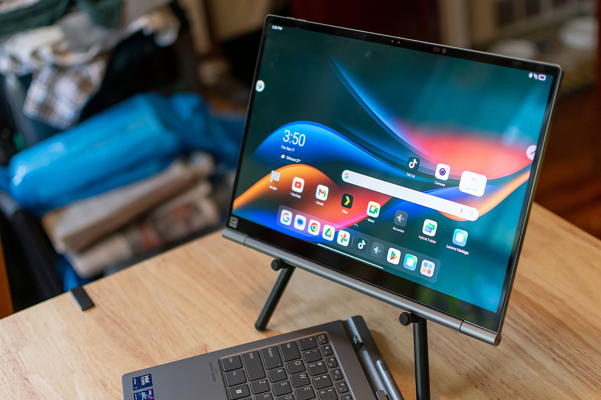 The Lenovo ThinkBook Plus Gen 5 Hybrid in tablet mode on its included tablet stand.