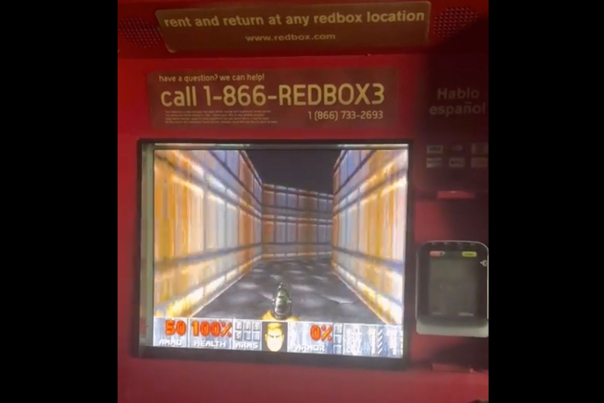 Someone playing Doom on a Redbox kiosk.