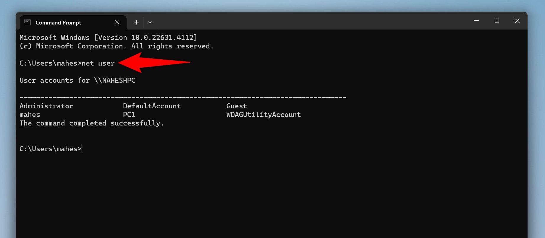 The 'net user' command typed in Command Prompt.