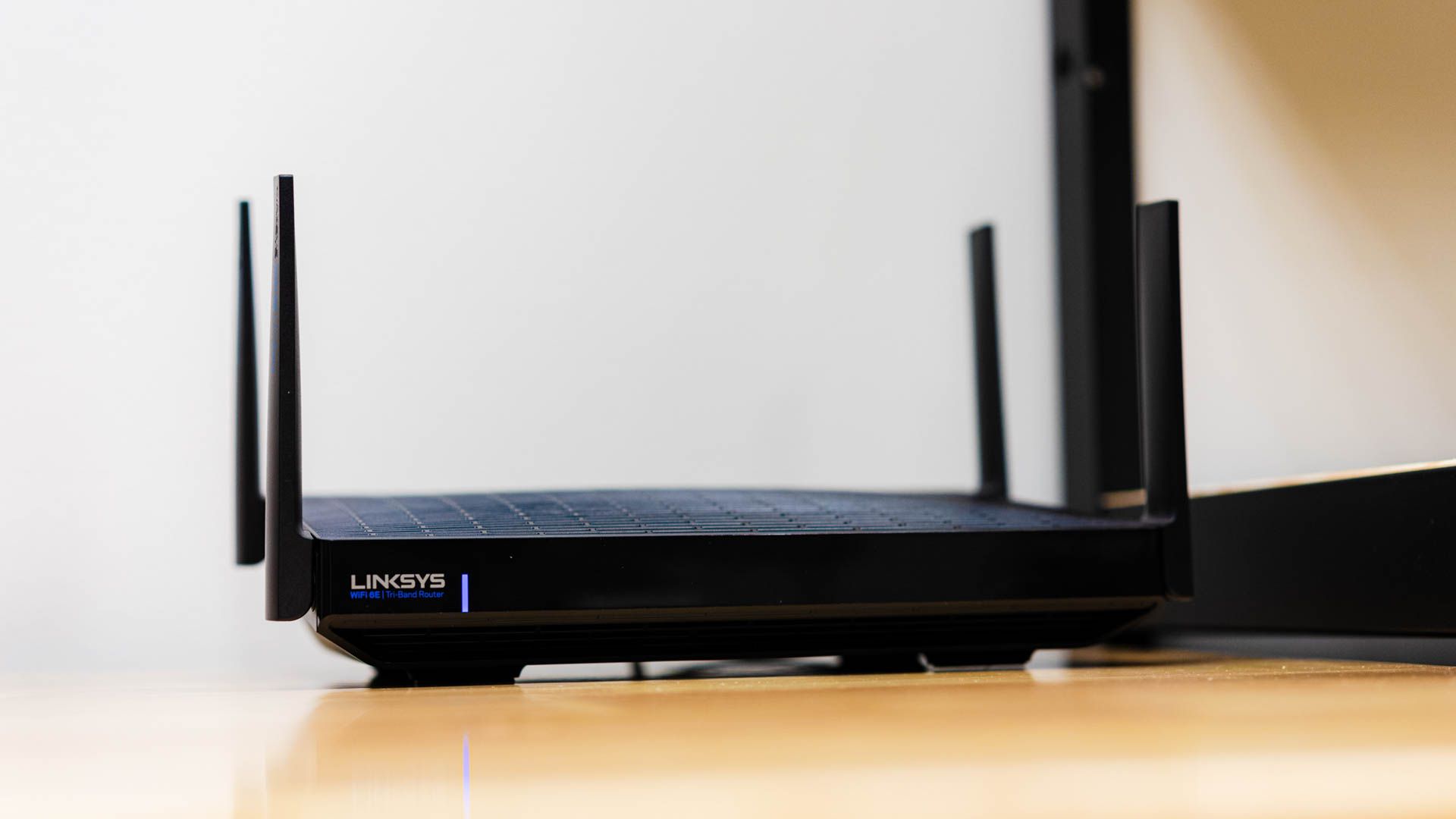 A Linksys tri-band router with four antennas set up.