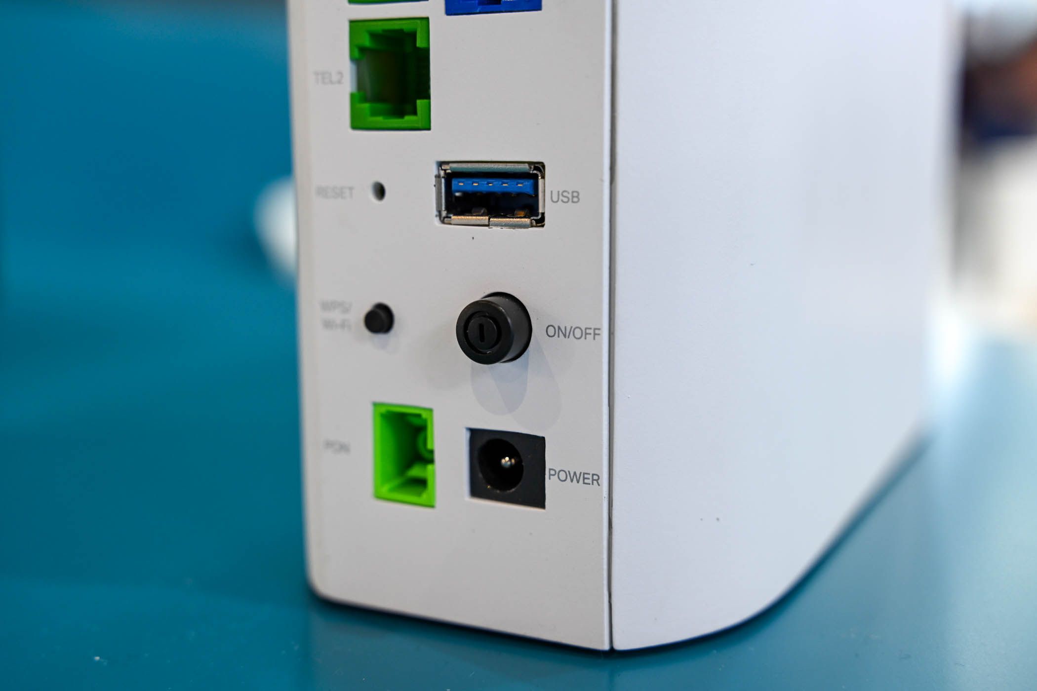 Power barrel jack and USB ports on the back of the BE7200 Dual Band WiFi 7 XGS PON VoIP Router.