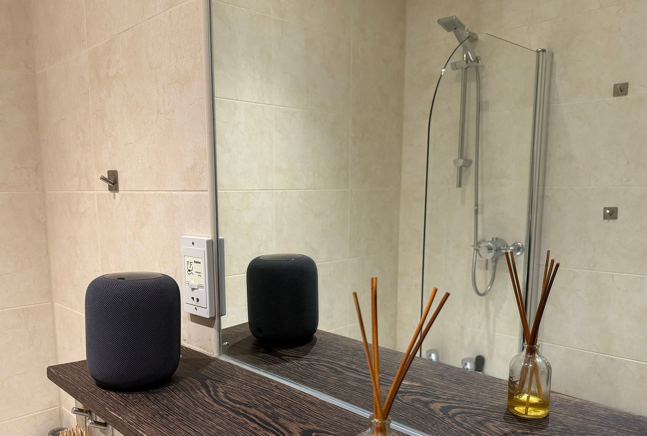 A HomePod smart speaker in a bathroom.