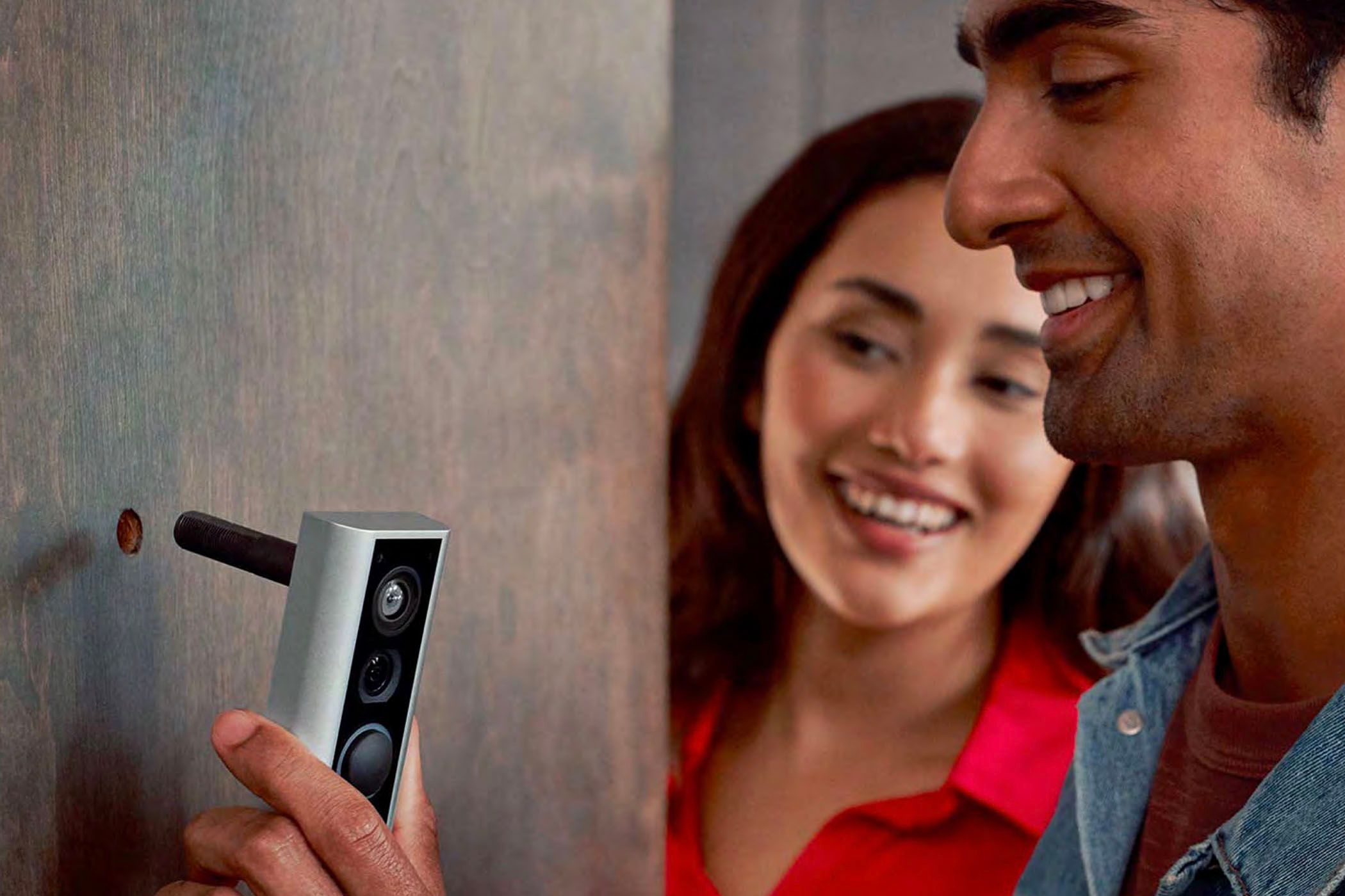 A smart doorbell replacing a peephole in an apartment door.