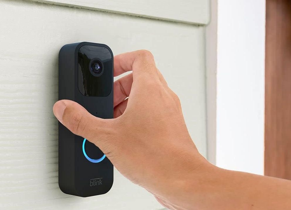 The blink video doorbell being installed outdoors. 