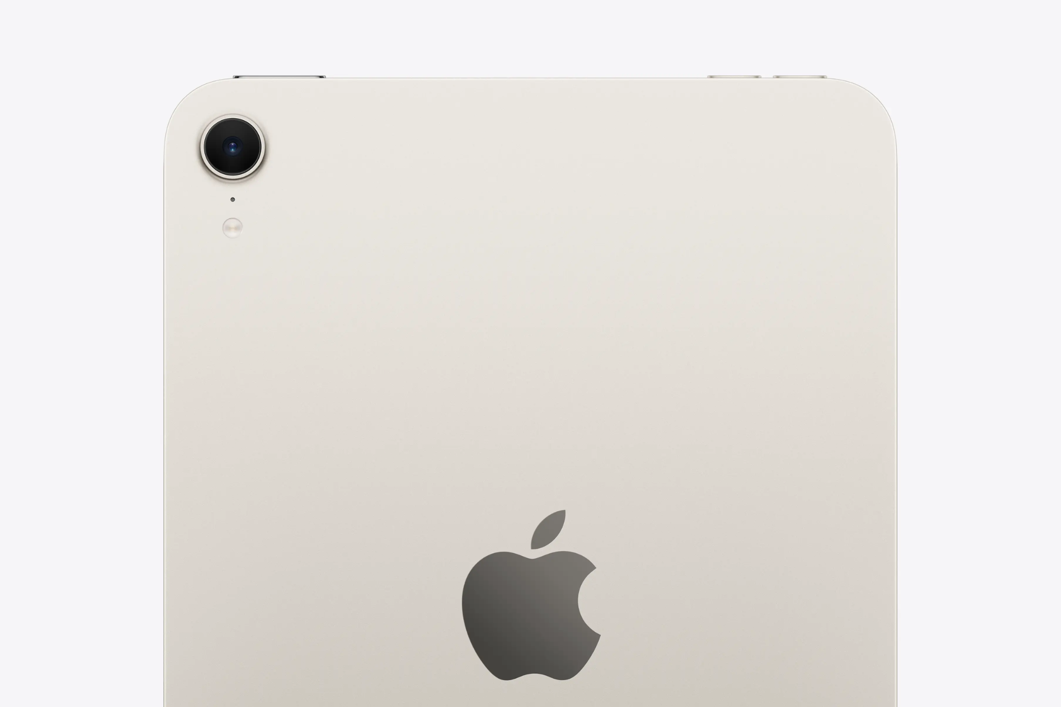 A starlight-colored iPad mini with a distinctive rear camera and Apple logo.