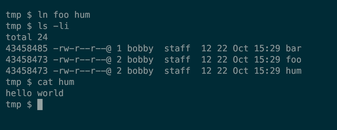 A Linux terminal showing three files, two of which reference the same inode.