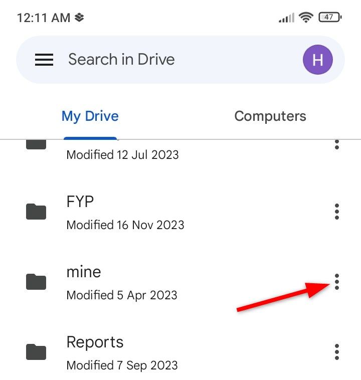 Locating and opening the file option menu in Drive.