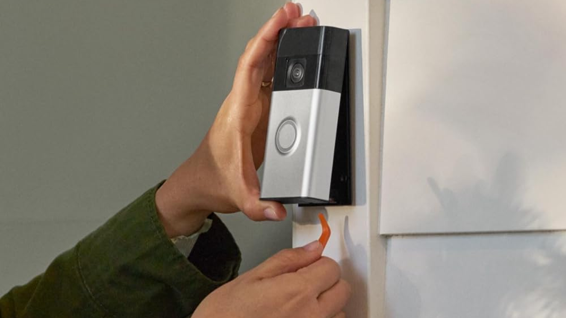 Installing a Ring video doorbell.