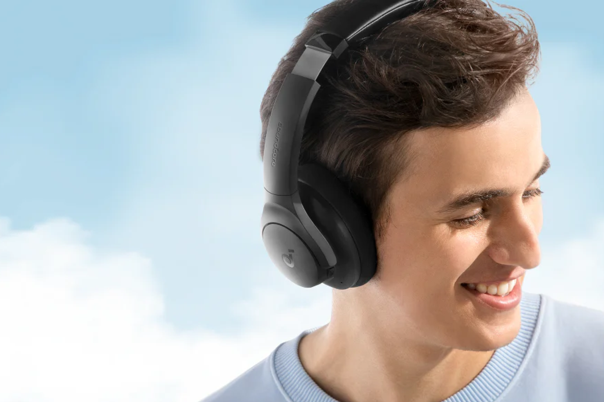 A person wearing a pair of Soundcore Anker Life Q20i headphones. 