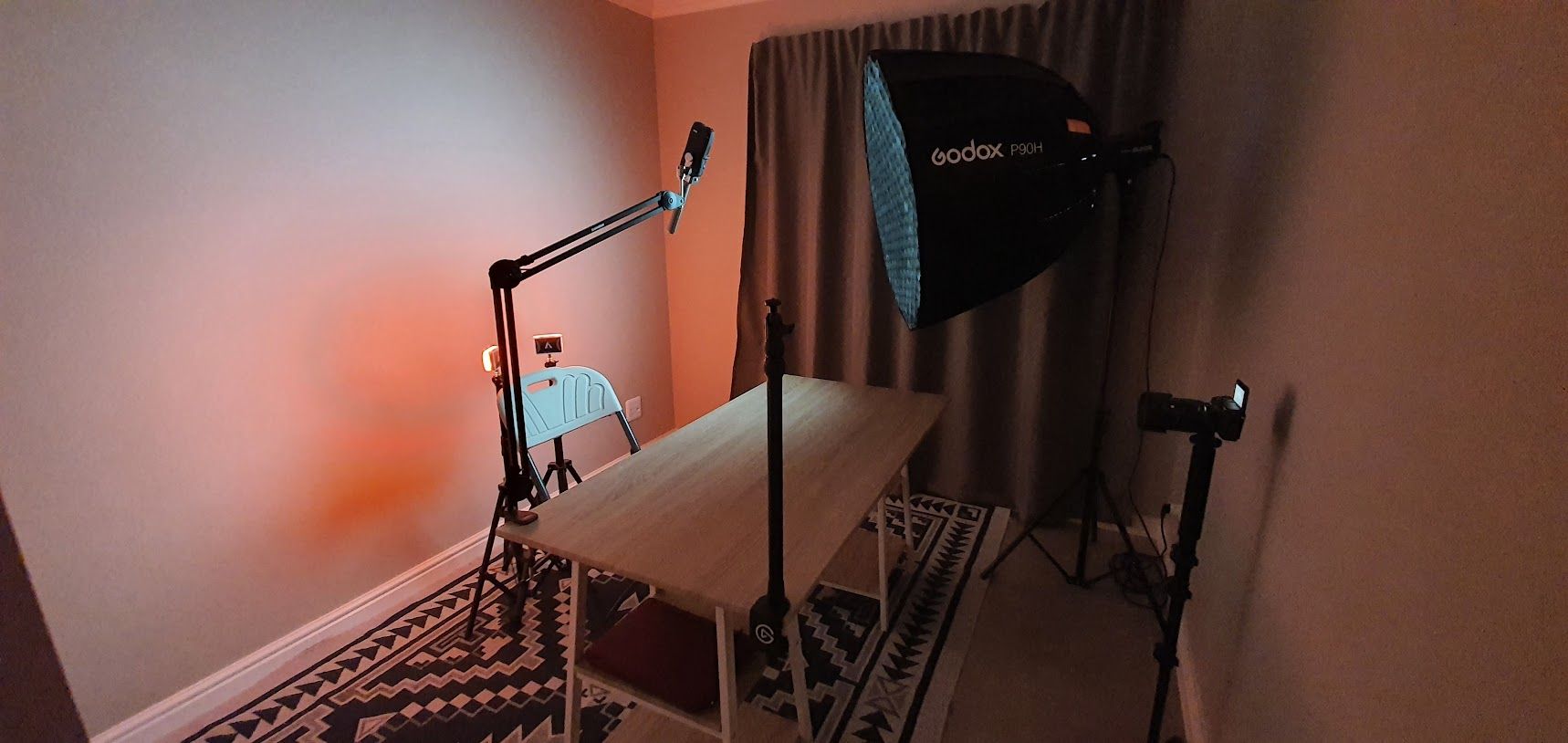 A YouTube studio setup using an off-screen shotgun mic.