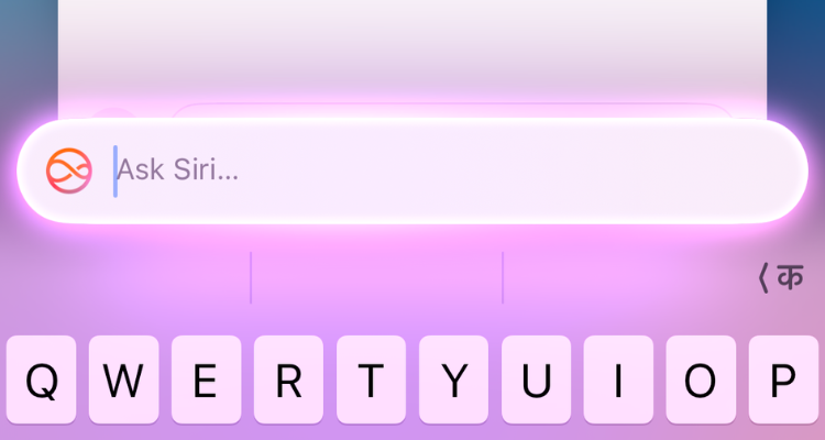 Screenshot of the Type to Siri interface with glowing pink lights around it.