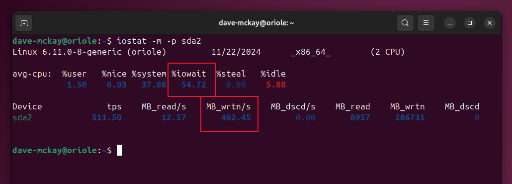 The output from dstat showing high waiting time and a high volume of disk writes.