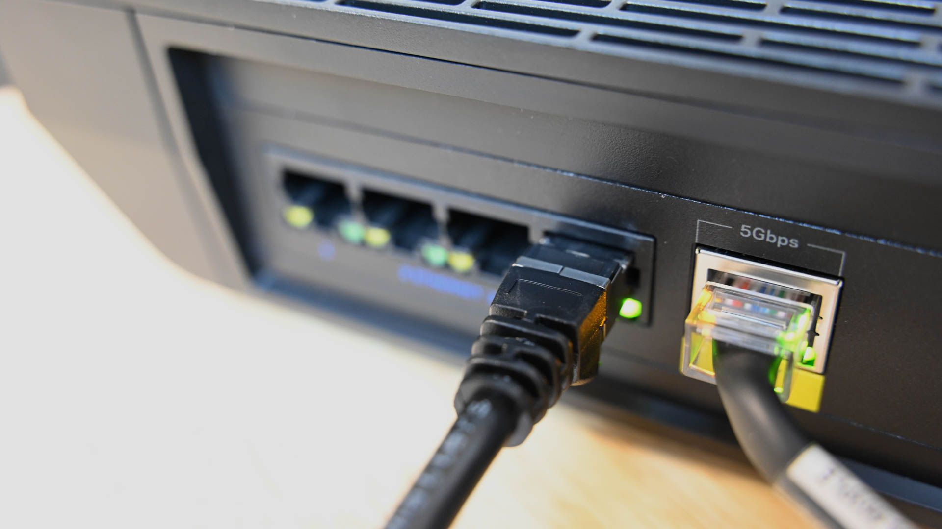 Close up of Ethernet cable plugged into an ethernet port on a router.