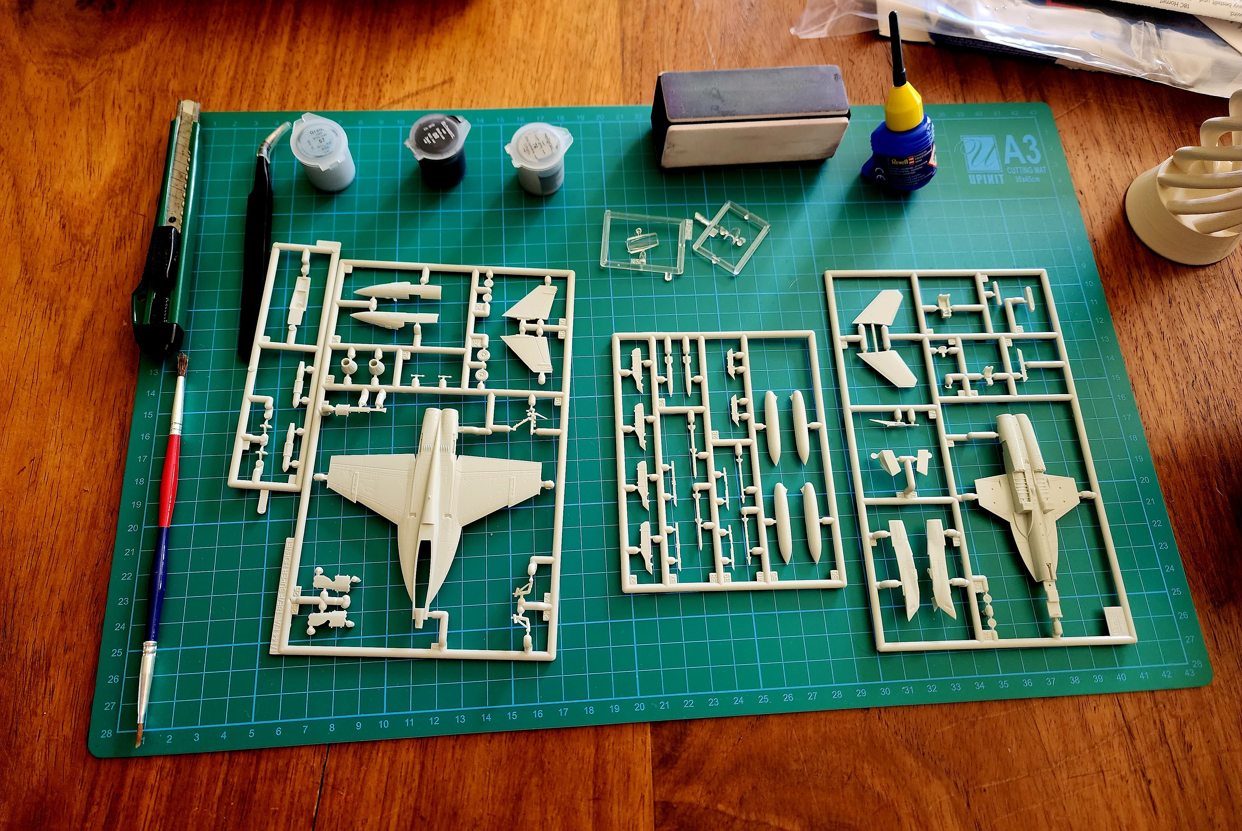 A model kit on a project cutting mat.