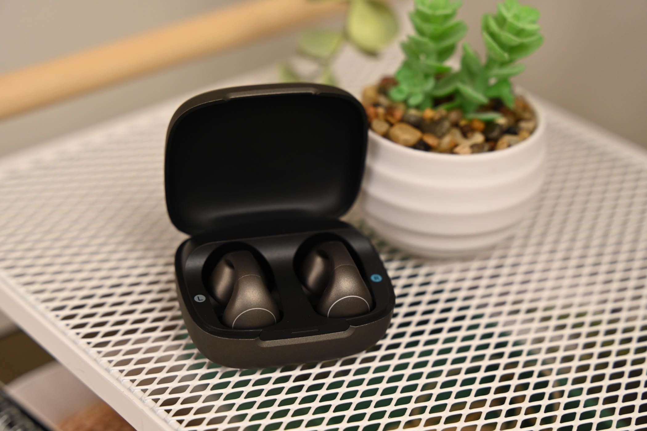 A pair of Soundcore C40i in their charging case.