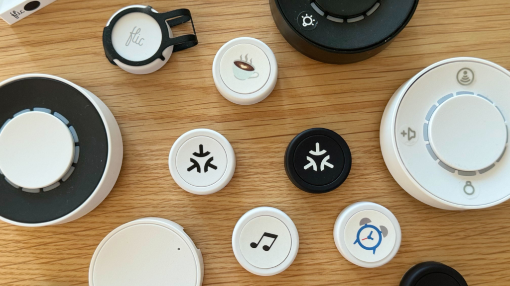 Flic devices on a table with icons on them.