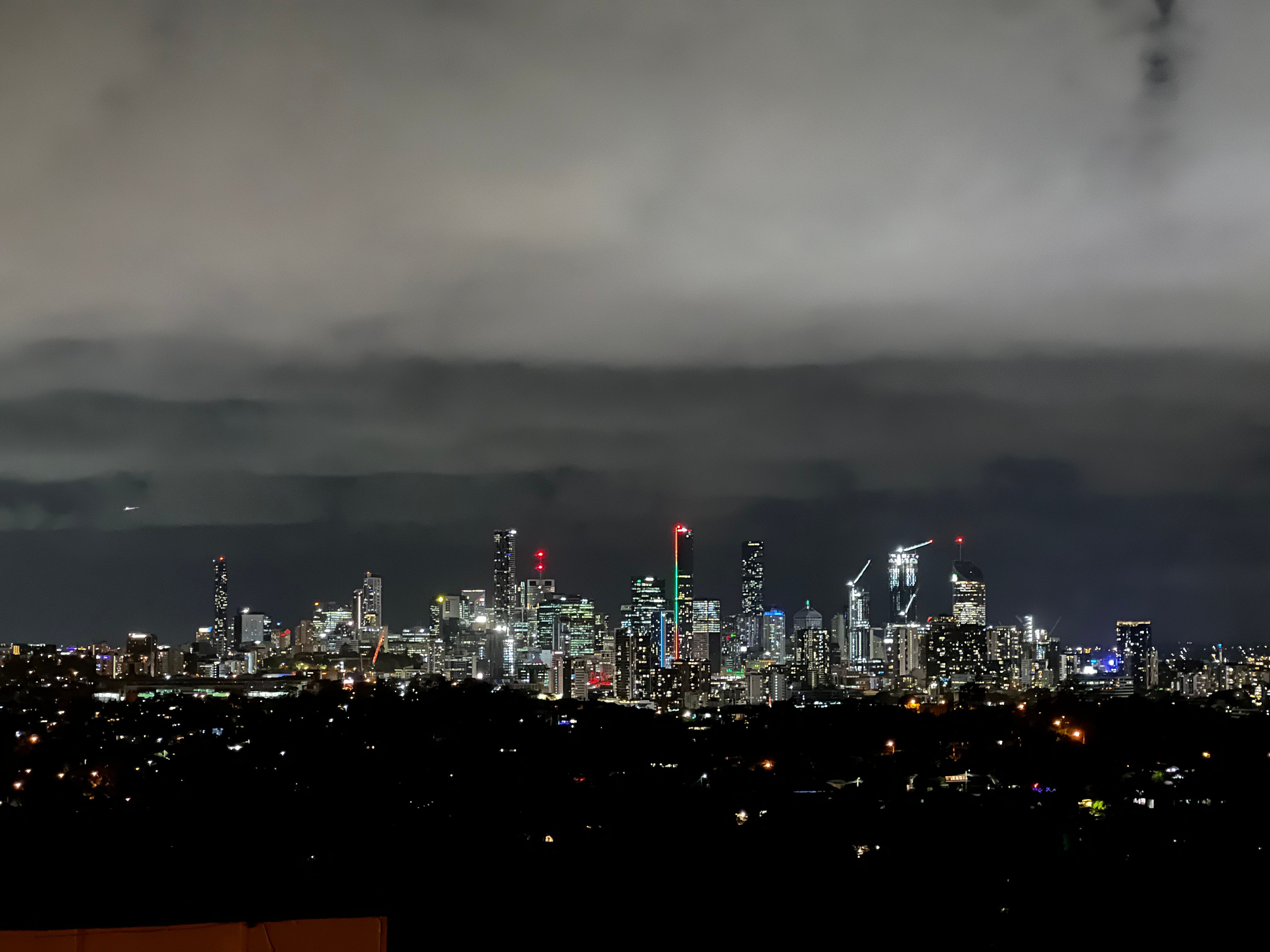 A shot of the Brisbane skyline taken on an iPhone 13 Pro with dark mode on.