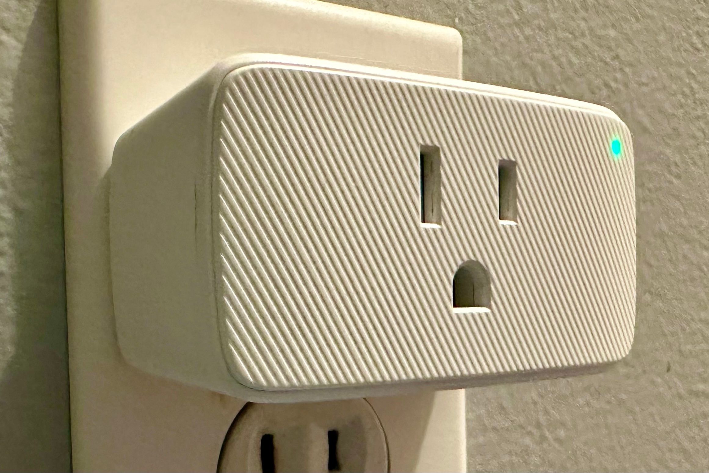 A VOCOlinc Smart Plug plugged into the wall waiting for a device to be plugged into it.